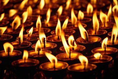 Burning candles in Buddhist temple. Dharamsala, Himachal Pradesh clipart
