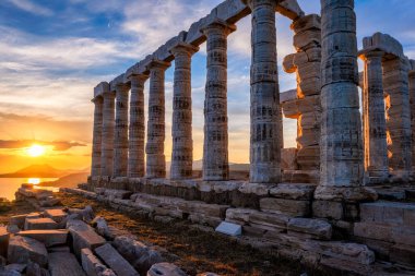 Poseidon temple ruins on Cape Sounio on sunset, Greece clipart