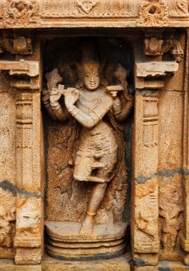 Krishna bas relief in Hindu temple. Sri Ranganathaswamy Temple. Tiruchirappalli, Tamil Nadu, India clipart