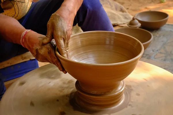 Pottery - skilled wet hands of potter shaping the clay on potter wheel — Stock Photo, Image