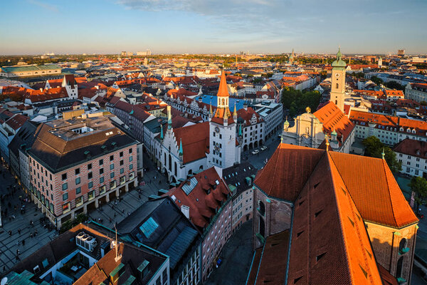 Aerial view of Munich - Marienplatz and Altes Rathaus from St. Peters church on sunset. Munich, Germany