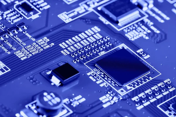 Electronic circuit board with electronic components such as chips close up. The concept of the electronic computer hardware technology.