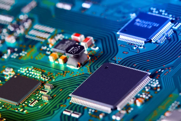 Electronic circuit board with electronic components such as chips close up. The concept of the electronic computer hardware technology.