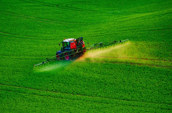 Farm machinery spraying insecticide