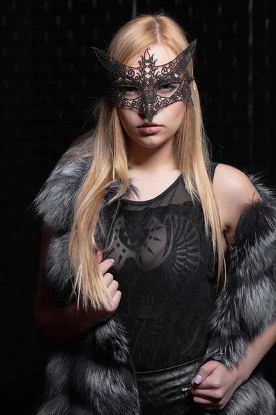 Young pretty blonde in a mask — Stock Photo, Image