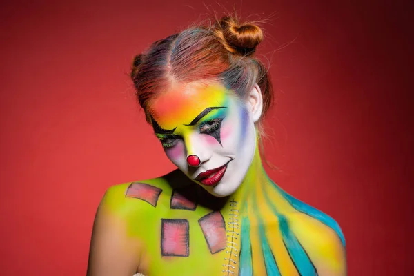 Cute young woman with a aqua makeup clown — Stock Photo, Image