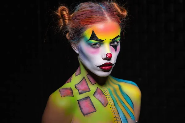 Alluring woman with a body art clown — Stock Photo, Image