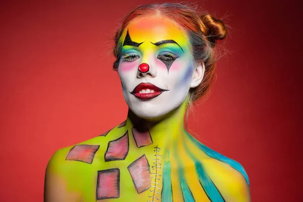 Nice young woman with a aqua makeup clown — Stock Photo, Image