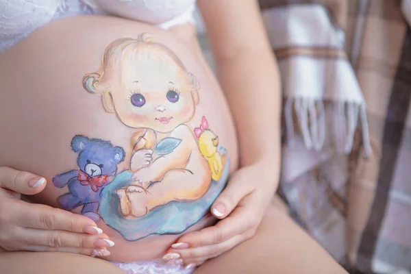 Cute drawing on the stomach of a pregnant woman — Stock Photo, Image