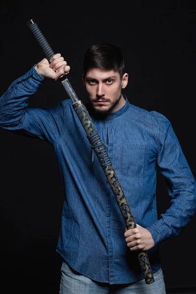 Handsome young man posing in studio — Stock Photo, Image