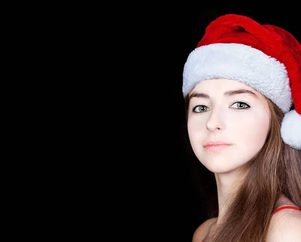 Weihnachten. junge Frau mit Mütze und als Weihnachtsmann verkleidet — Stockfoto