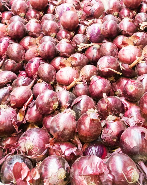 Red onions in plenty. food background