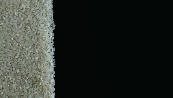 Ρύζι αριστερό μαύρο φόντο — Φωτογραφία Αρχείου