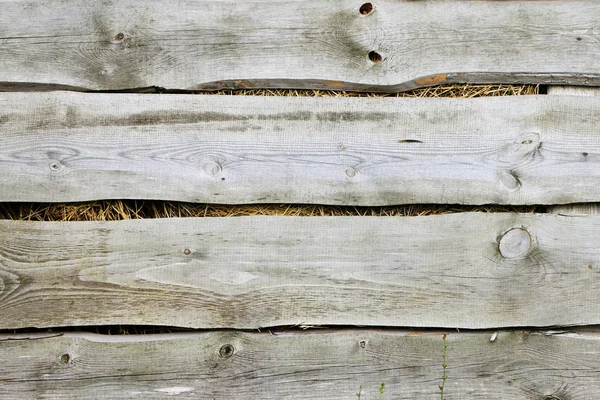 Old wooden fence background hay — Stock Photo, Image