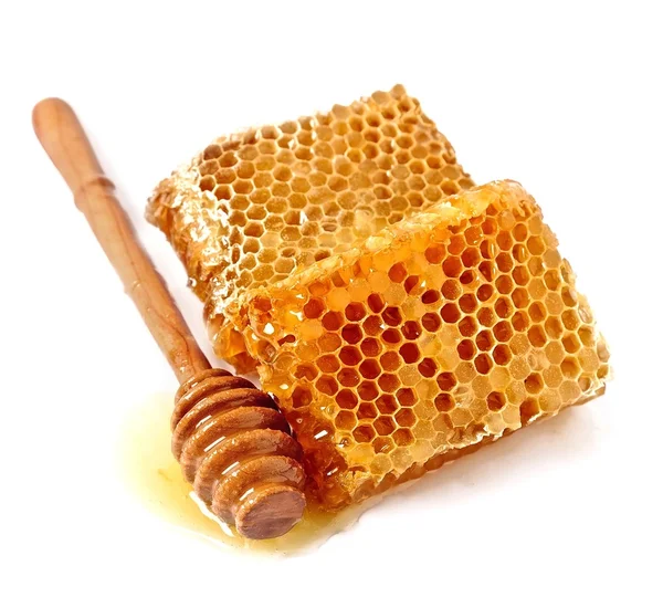 Honey dipper with honeycomb — Stock Photo, Image