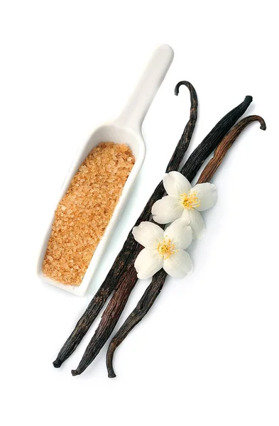 Vanilkového cukru a biče s květinami . — Stock fotografie