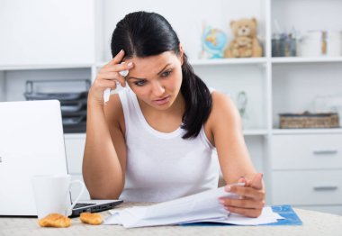 Sad woman working with documents clipart