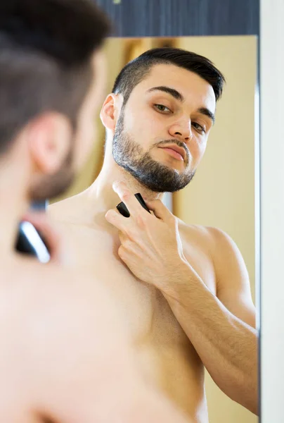 Handsome man applying perfum — Stock Photo, Image