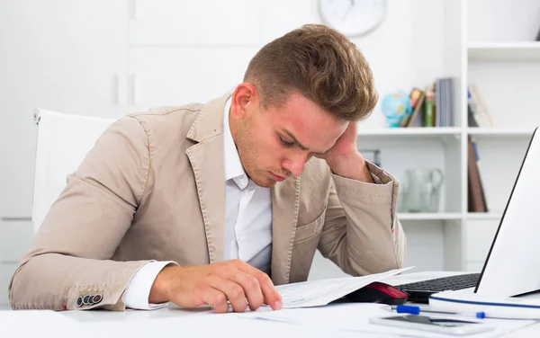 Tired man working in office — Stock Photo, Image