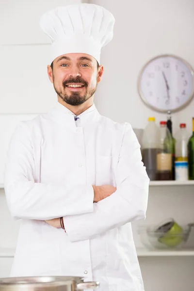Male cook preparing food Stock Picture