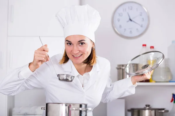 Smiling Female Cook Checking Taste Food While Preparing Kitchen — Stock Photo, Image