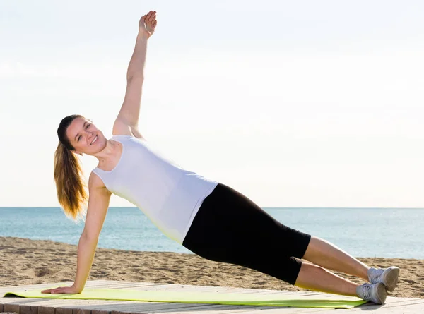 Young Woman Doing Yoga Poses Sitting Sunny Beach Ocean Morning — Stock Photo, Image