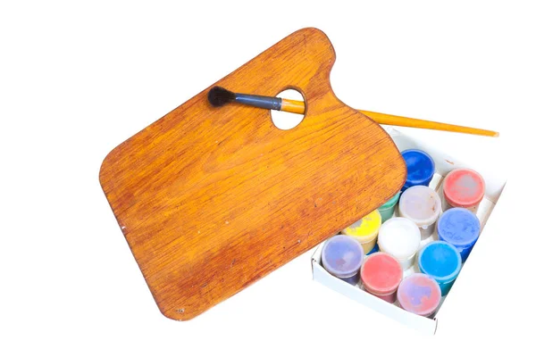 Fırça ile boya ve malbert beyaz bir arka plan üzerinde büyük