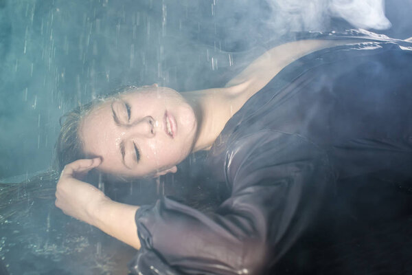 Portrait of the girl under drops