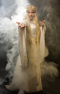 The blonde in a smoke pulls a hand