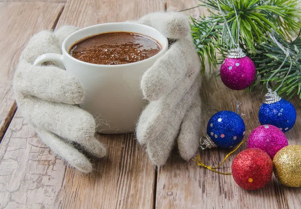 Knitted gloves and chocolate — Stock Photo, Image