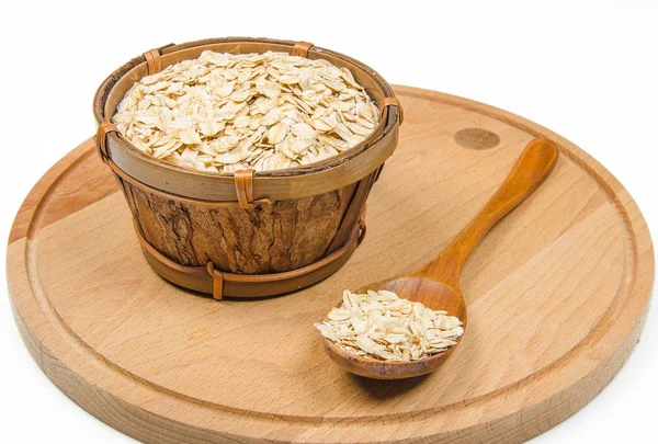 Rolled oats in wooden bowl — Stock Photo, Image