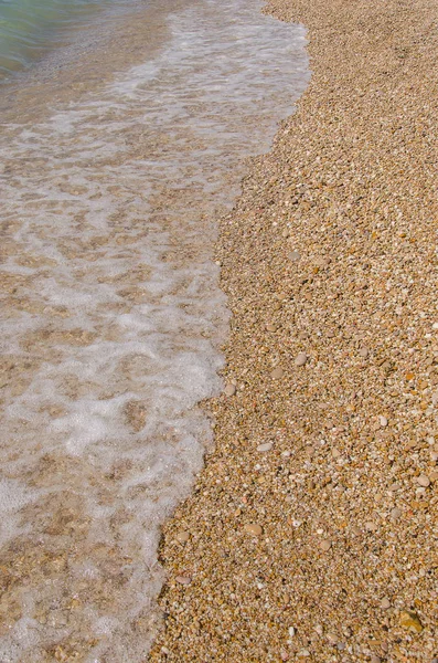 Kiezels en zand — Stockfoto