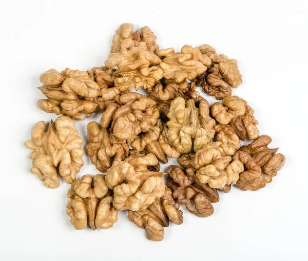 Heap of walnut kernels on white — Stock Photo, Image