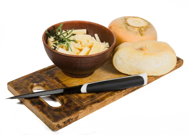 Turnip and a knife on a cutting board — Stock Photo, Image