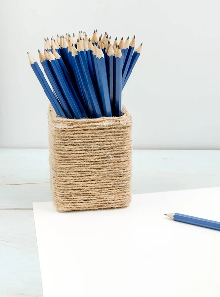 Graphite pencils in box with page — Stock Photo, Image