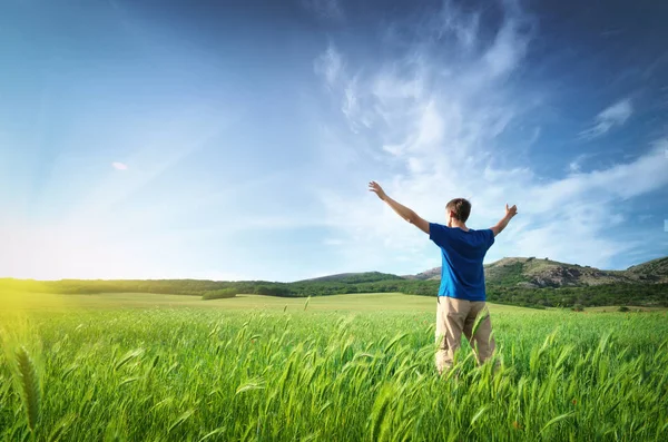 Man in green meadow — Stock Photo, Image