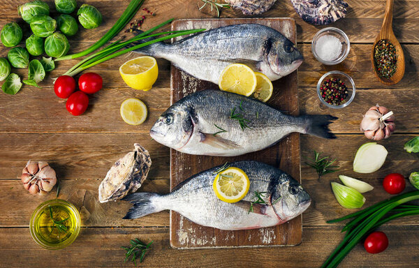 Fresh  raw fish with herbs, spices and vegetables