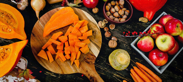 Autumn food composition on a dark wooden background. 