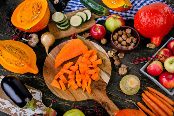 Autumn food composition on a dark rustic wooden background. 