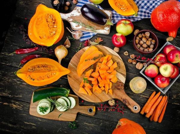 Autumn food composition on dark rustic wooden background.