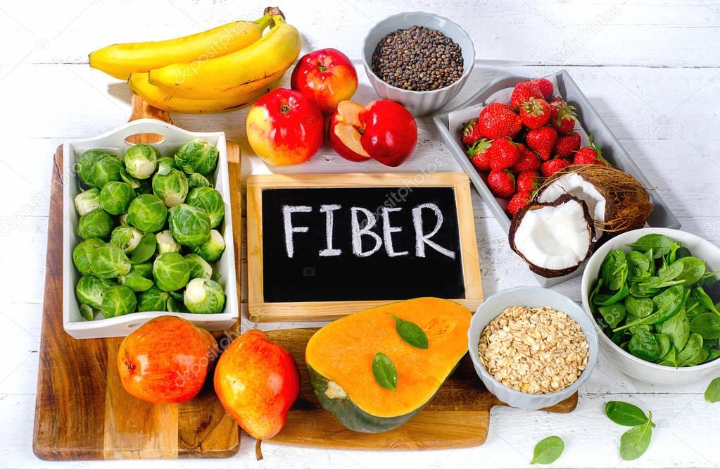 High Fiber Foods on a white wooden background. 