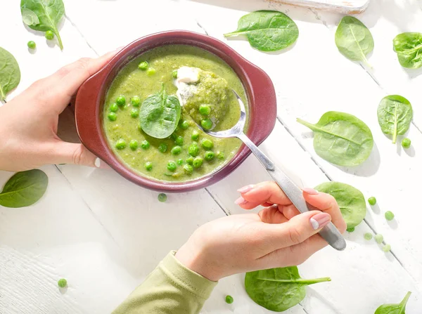 Woman hands with Bowl of pea soup. — Stock Image Woman hands with Bowl of pea soup. Stock Picture