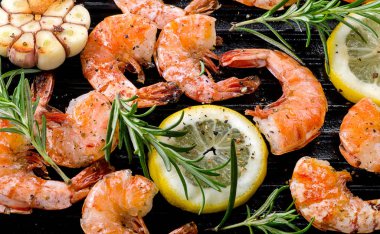 Shrimps roasted on grill pan  clipart