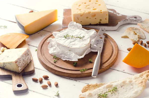 Cheese with almonds and bread — Stock Photo, Image