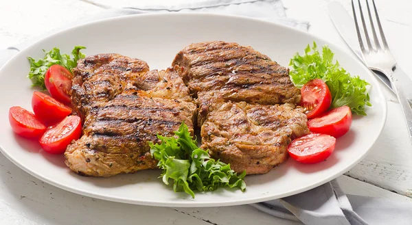 Grilled pork steaks — Stock Photo, Image