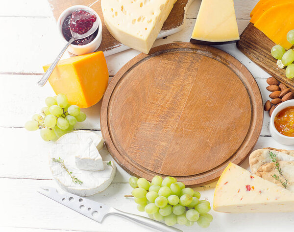 Assorted cheeses served with grapes