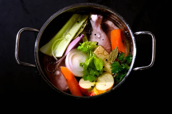 Ingredients of healthy soup in pot — Stock Photo, Image