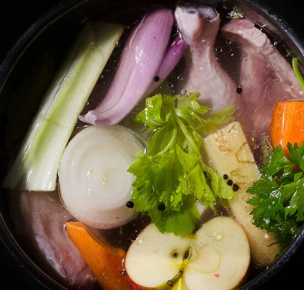 Ingredients of healthy soup in pot — Stock Photo, Image