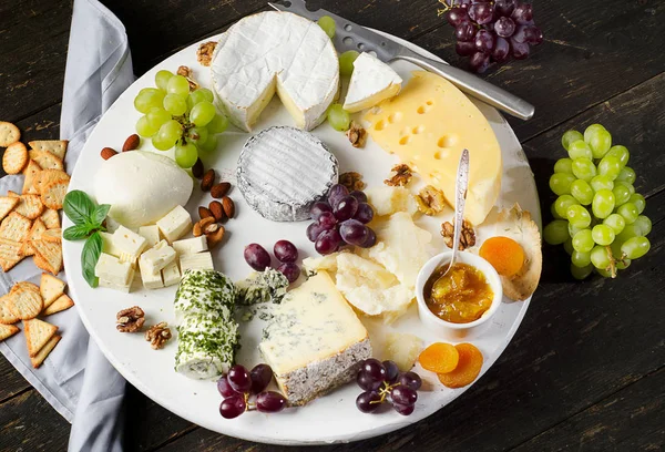 Cheese plates served with grapes, jam and nuts — Stock Photo, Image