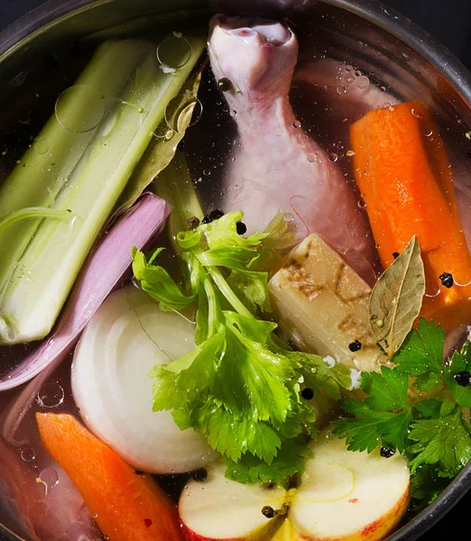 Ingredients of healthy soup in pot — Stock Photo, Image